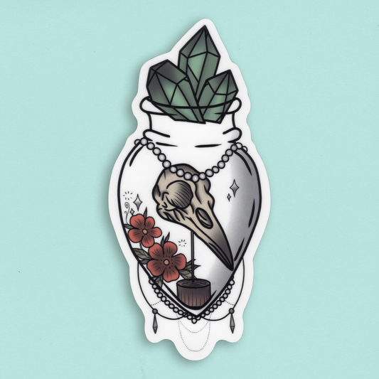 Die-Cut tarra – Eläimen pääkallo, kukkia ja kristalleja pullossa